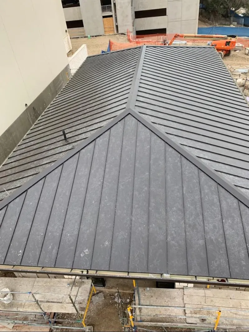 Commercial metal roof construction with crane equipment in Angola