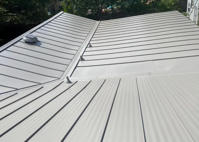 Solar attic fan installed on a metal roof for Roof Ventilation in Angola